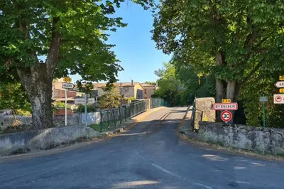 an empty street with signs on the side of the road at Diamond - Gîte dans vieux prieuré près de Carcassonne in Sainte-Eulalie