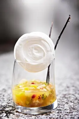 a glass jar filled with food on a table at Hôtel Mets et Plaisirs in Mazamet