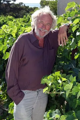 an older man standing in a field of plants at Pavillon Grazel GRUISSAN in Gruissan