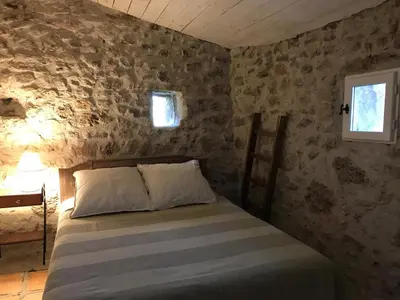 a kitchen with a wooden counter top in a room at Bergerie éco-gîte Serre Rouge in Durban-Corbières