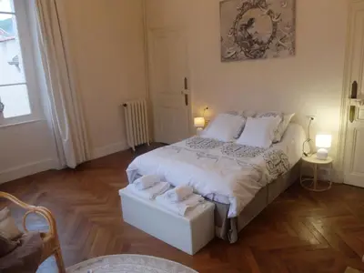 a bedroom with a bed with two towels on it at La Maison d'hôtes du Chapelier in Espéraza