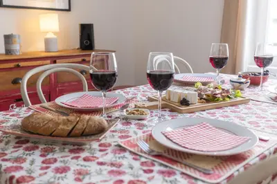 a table with glasses of wine and food on it at Central Narbonne with rooftop terrace in Narbonne