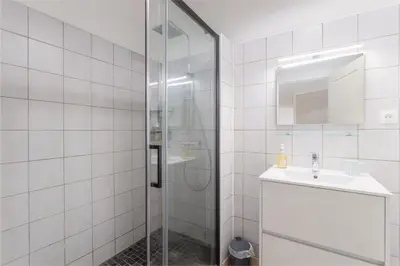 a bathroom with a shower and a sink at Central Narbonne with rooftop terrace in Narbonne