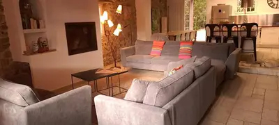 a living room with two couches and a table at les galets de l agly, 6 ch, 12 couchages Semaine ou WE famille amis copains in Le Vivier