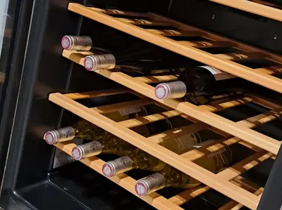 a bunch of bottles of wine in an oven at les galets de l agly, 6 ch, 12 couchages Semaine ou WE famille amis copains in Le Vivier