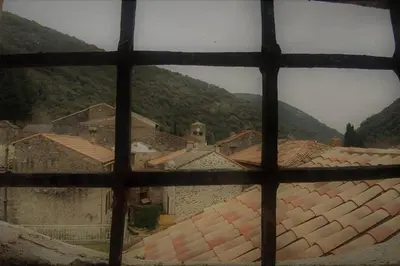 a view from a window of a town with roofs at Havre de paix au pied de la montagne in Les Ilhes