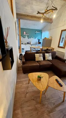 a living room with a couch and a table at le joyau de la cite in Carcassonne