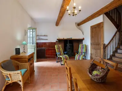 a kitchen and dining room with a table and chairs at Charming Holiday Home in Tautavel with Balcony in Tautavel