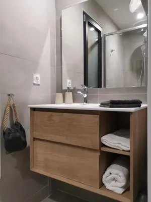 a bathroom with a sink and a mirror at Suite l'inattendu avec Spa privatif et espace bien-être. in Moussan