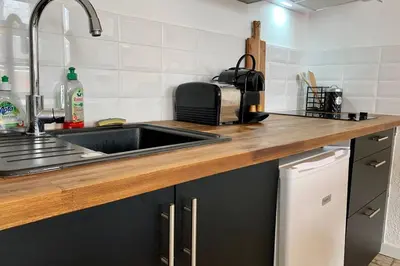 a kitchen with a sink and a counter top at Duplex Carcassonne centre in Carcassonne