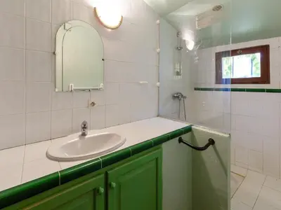 a bathroom with a sink and a mirror at Holiday Home in Tautavel near Gorges de Gouleyrous in Tautavel