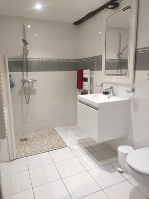 a white bathroom with a sink and a shower at Les chambres de la Caussade in Lautrec