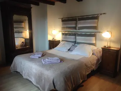 a bedroom with a bed with two towels on it at Les chambres de la Caussade in Lautrec