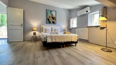 a bedroom with a bed and two lamps in it at Gites-Terroirs-Occitanie in Felluns