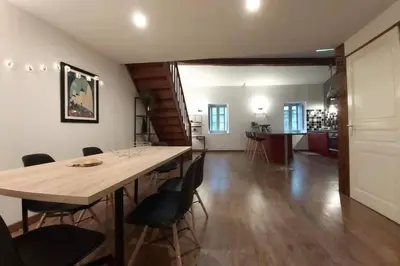 a large dining room with a large table and chairs at Le 68b in Carcassonne