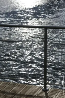 a metal railing on a boat in the water at Les Ilots de Gruissan in Gruissan