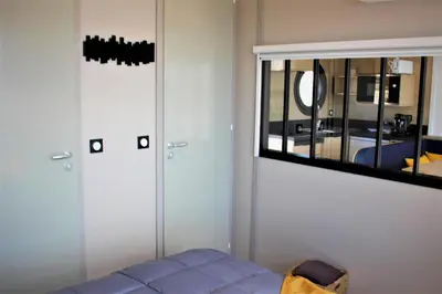 a room with two closets and a mirror at Les Ilots de Gruissan in Gruissan