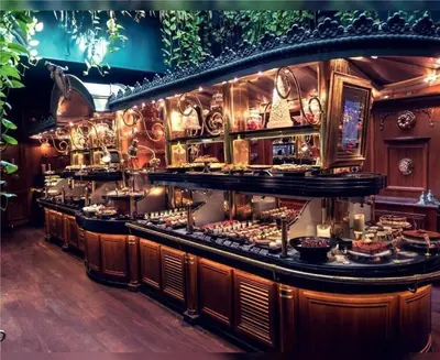 a restaurant with a buffet of food on display at Le Bourget - Envolée Romantique in Narbonne