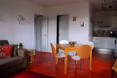 a living room with a wooden table and chairs at Gîte - Holiday Home Vent Marin in Limoux