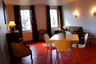 a living room with a table and chairs at Gîte - Holiday Home Vent Marin in Limoux