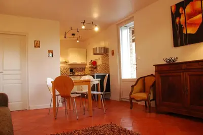 a kitchen and dining room with a table and chairs at Gîte - Holiday Home Vent Marin in Limoux
