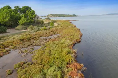 an island in the middle of a body of water at Mobil Home climatisé 6 personnes in Port-la-Nouvelle