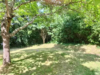 a cabin with awning and a picnic table in front of it at Camping La Bernede in Rennes-les-Bains