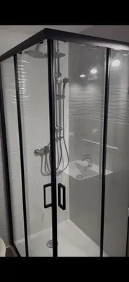 a shower stall with a sink in a bathroom at LA MAISON DU LAC climatisée et WiFi gd F3 in Port-la-Nouvelle