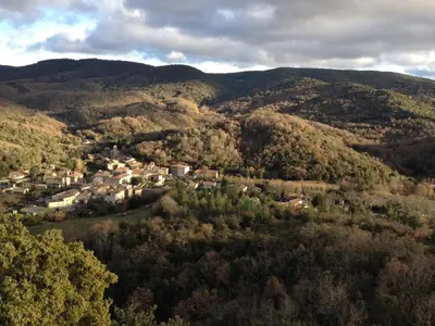 an aerial view of a small town in the mountains at Aux Berges du Libre in Félines-Termenès