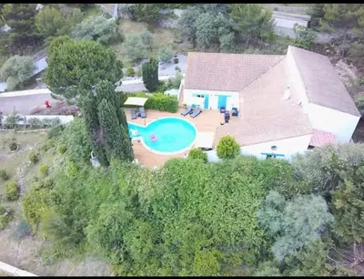 an aerial view of a house with a swimming pool at La Villa Du Menhir Chambre d'hôtes in Bize-Minervois