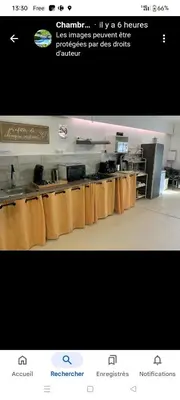a picture of a restaurant kitchen with a counter at La Villa Du Menhir Chambre d'hôtes in Bize-Minervois