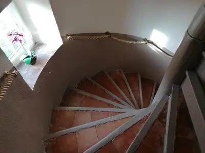 an overhead view of a spiral staircase in a house at Gite Joséphine dans une tour médiévale - Carcassonne in Saint-Hilaire