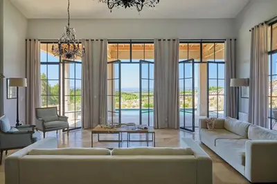 a living room with a couch and a table at Château Capitoul in Narbonne