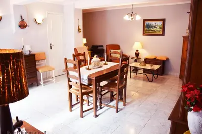 a dining room with a table and chairs at La Petite Maison in Cesseras