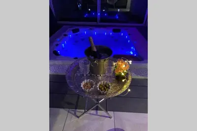 a table with a bowl of food on top of it at Koh Samet Siam Manahakhon Appart & Spa in Rieux-de-Pelleport