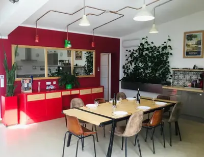 a dining room with a table and chairs at Casa Léon in Narbonne