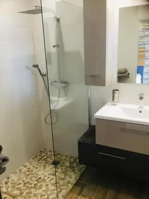 a bathroom with a shower and a sink at Casa Léon in Narbonne