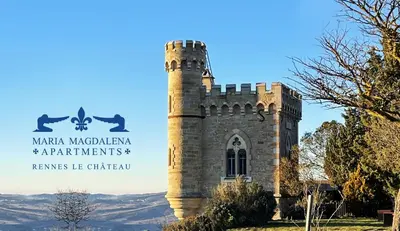 a castle with a sign in front of it at Maria Magdalena Apartments in Rennes-le-Château