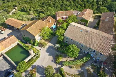 an overhead view of a large house with a swimming pool at Chambres d'hôtes Château de Jonquières in Narbonne