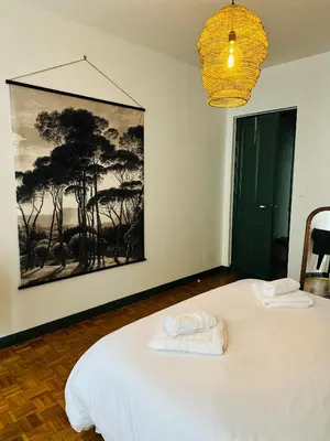 a room with a bed with two towels on it at 102 - Cheminée de la Bastide in Carcassonne