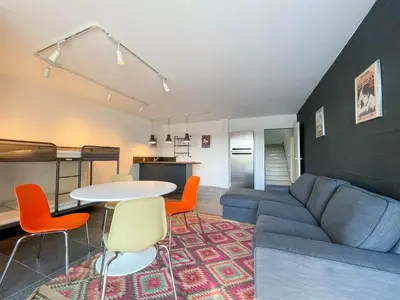 a living room with a couch and a table at Villa des Cathares in Carcassonne