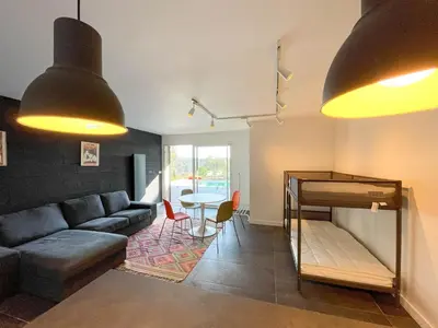 a living room with a couch and a table at Villa des Cathares in Carcassonne