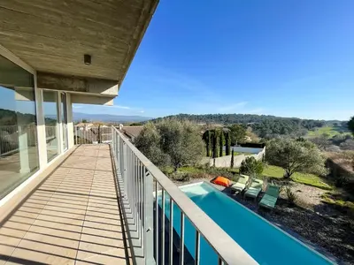 a balcony of a house with a swimming pool at Villa des Cathares in Carcassonne