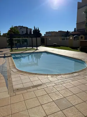 a large swimming pool on top of a building at Les Drom's studio in Gruissan