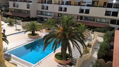 an overhead view of a swimming pool in a building at Les Drom's studio in Gruissan