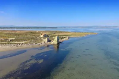 an island in the middle of a body of water at Mobil home 5-6 personnes - climatisé in Port-la-Nouvelle
