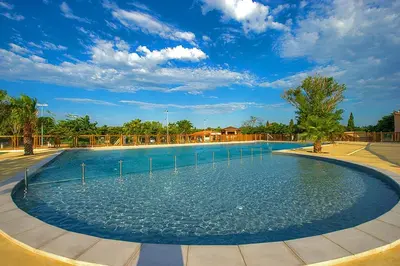 a large pool of water in a park at Mobil home 5-6 personnes - climatisé in Port-la-Nouvelle
