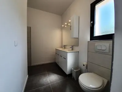 a small bathroom with a toilet and a sink at Villa with Pool & Views in Oupia