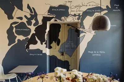 a room with a wall mural of a cow at La Maison de Gruissan in Gruissan