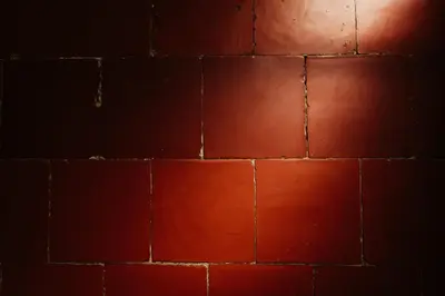 a red brick wall in a dark room at La Maison de Gruissan in Gruissan